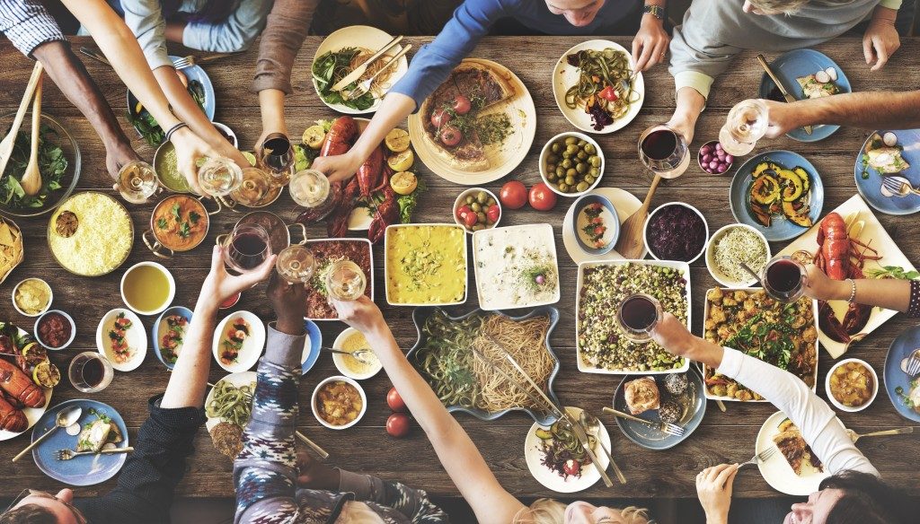 people happily sharing meal