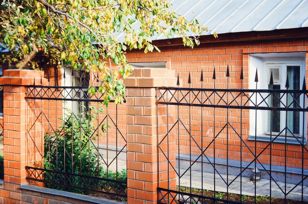 Metal fence with brick columns