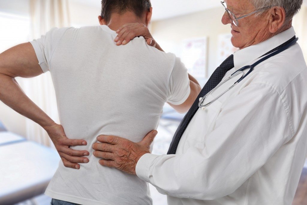 Letting the doctor check your back pain