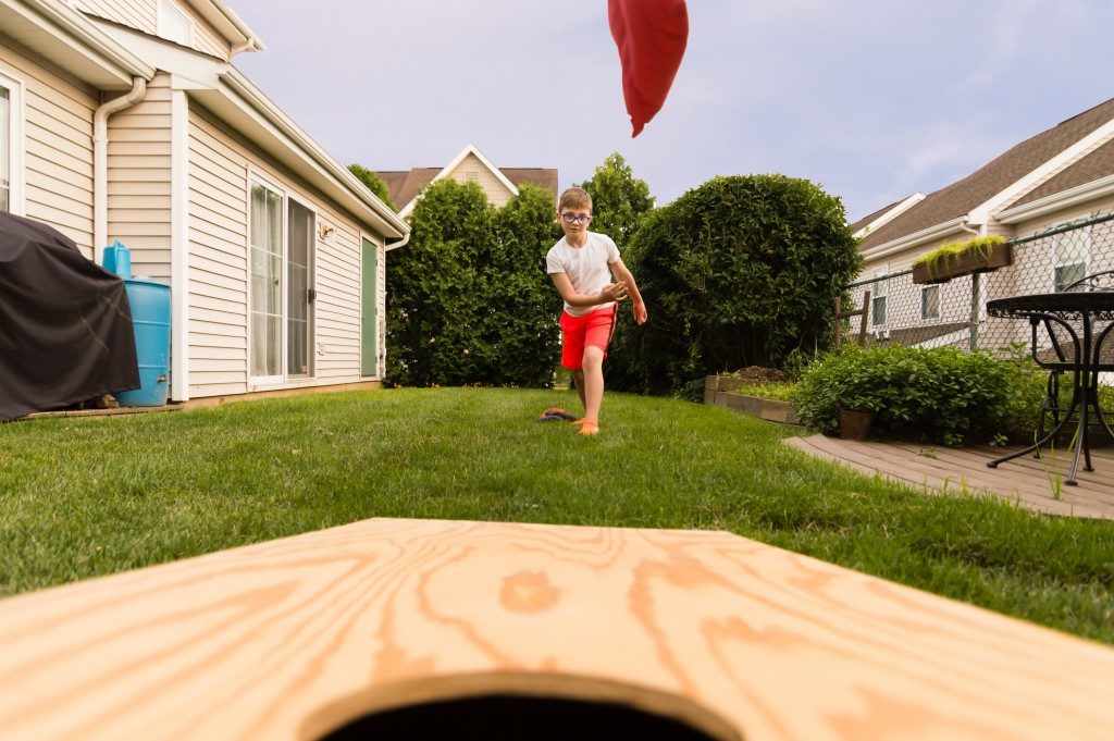 kid playing in the backyard