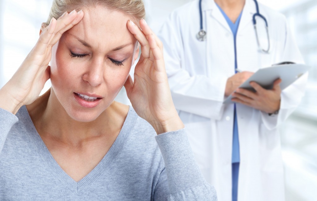 woman experiencing headache