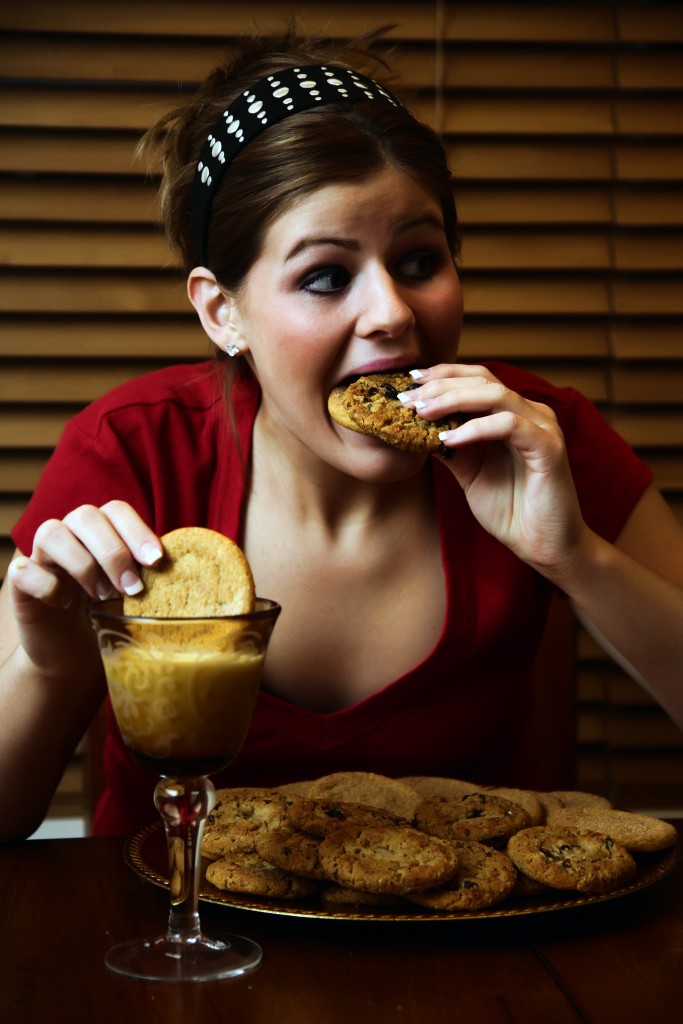 Woman eating cookies