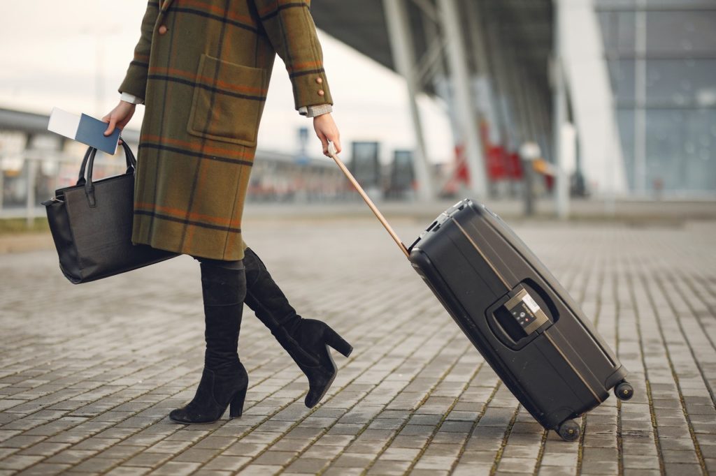 woman dragging luggage