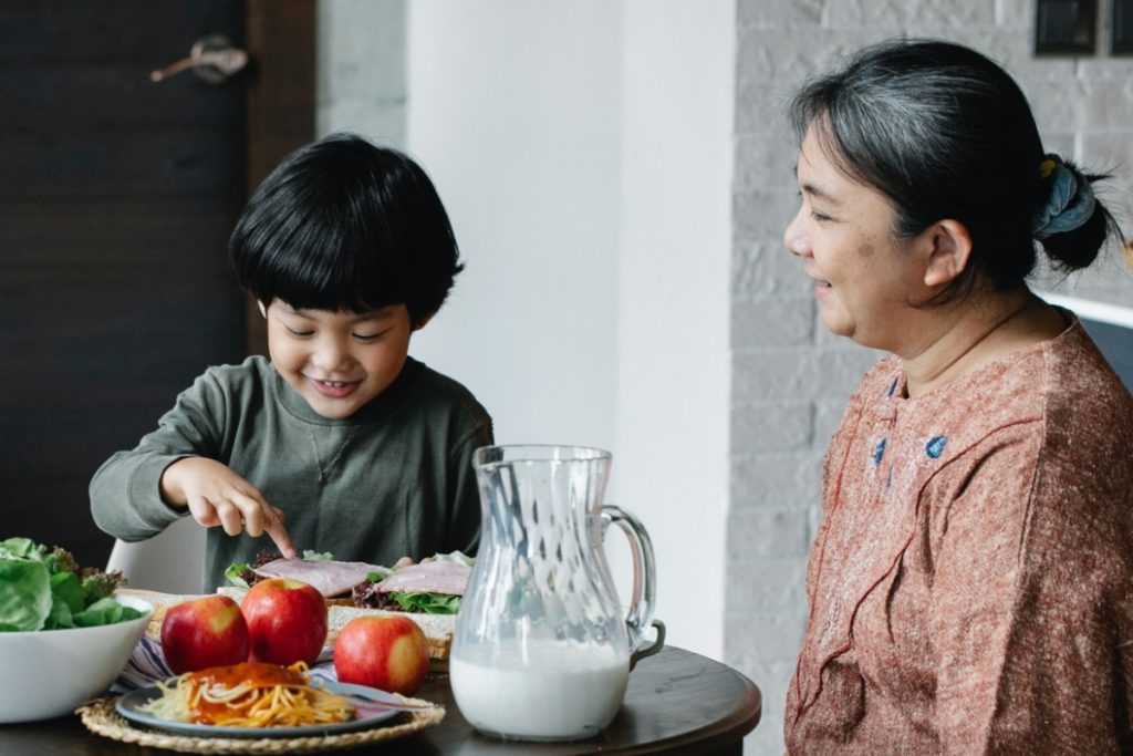 grandmother and grandson eating