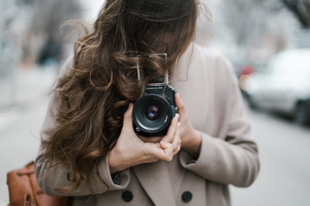 woman holding a camera