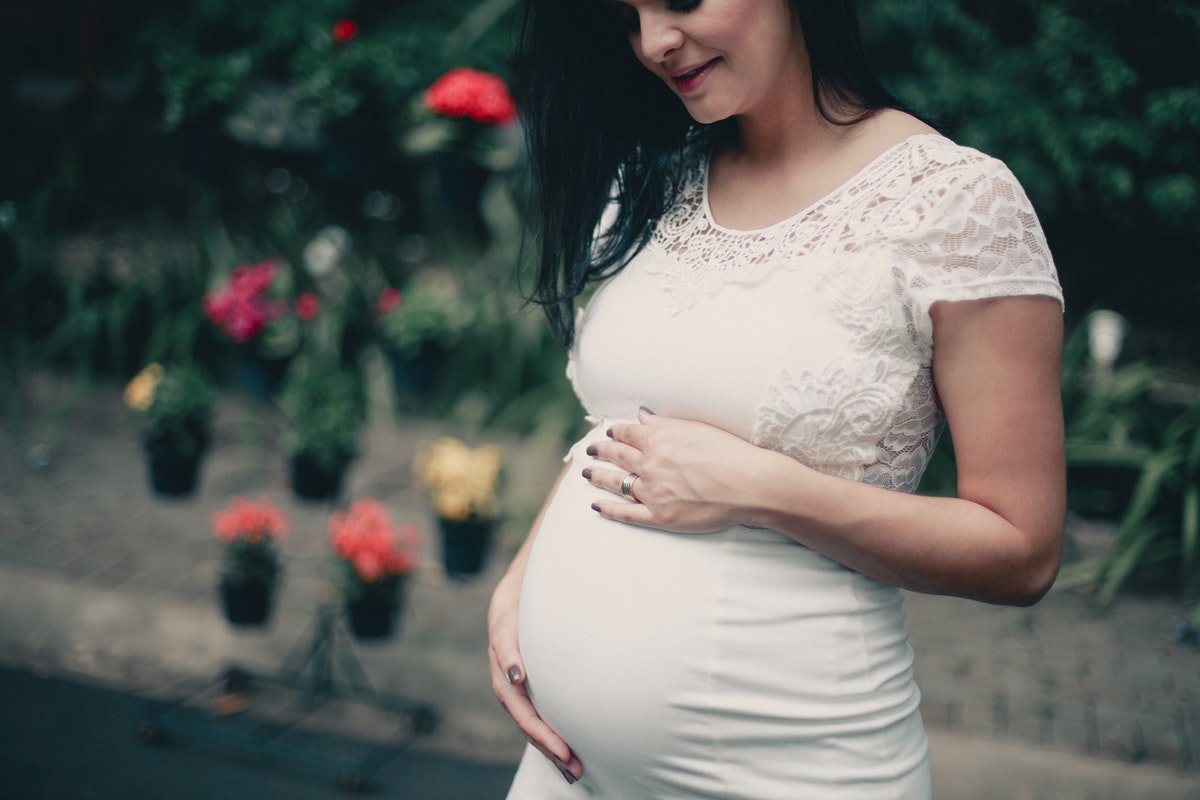 pregnant woman wearing white dress