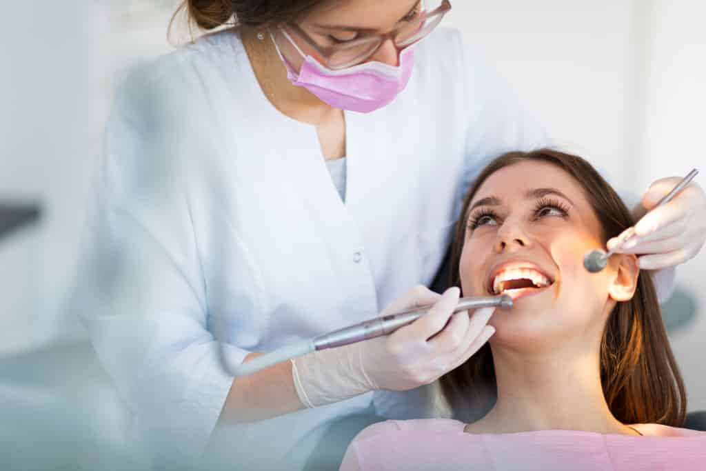 Woman having dental check up