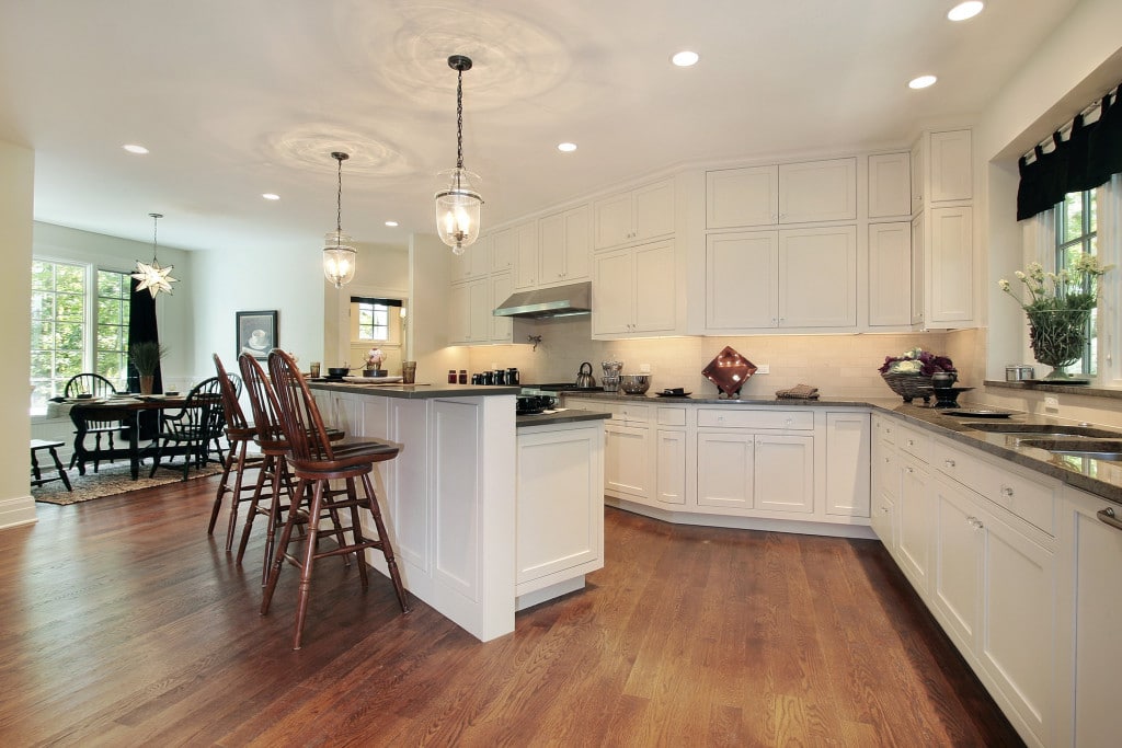 A kitchen with aesthetic light fixtures